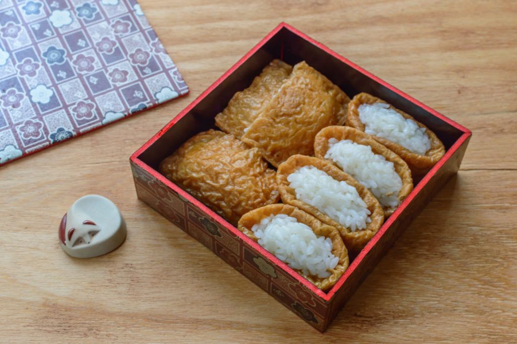 Inari Sush, a Japanese dish made of sushi rice wrapped inside the seasoned deep-fried tofu pockets